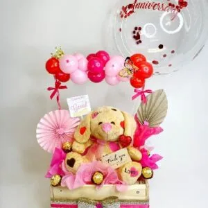 Arreglo de peluche con chocolates 10”